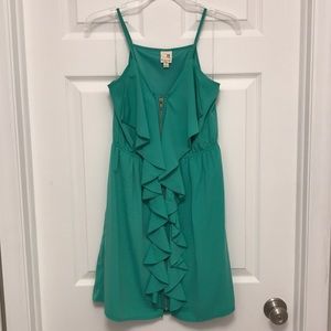 Green cocktail dress with front ruffle detail